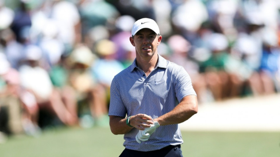 McIlroy scrambles to hold off rivals and keep Masters lead