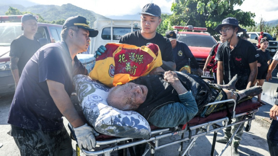 Taiwan races to rescue two dozen missing after barrier lake burst