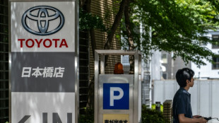 Weak yen helps auto giant Toyota raise forecasts