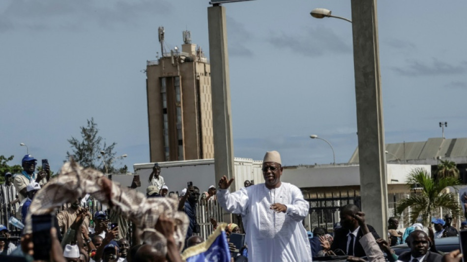 Ex-president Sall back in Senegal for talks with successor