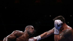 Dubois climbs off the canvas to become two-time world heavyweight champion