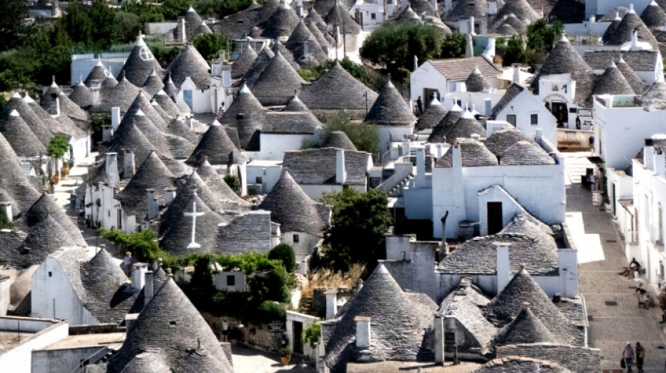 Heat-struck Italians cool off in ancient stone 'trulli'
