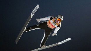 Domen Prevc secures Four Hills ski jump title to emulate brother