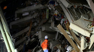 Mothers search, men weep amid debris of Venezuela quakes